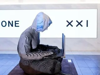 รูปปั้นซาโตชิ นากาโมโตะ ที่ติดตั้งอยู่ที่ตลาดหลักทรัพย์นิวยอร์ก ซึ่งจะหายไปในที่สุด กลายเป็นรูปปั้นที่หกของโลก